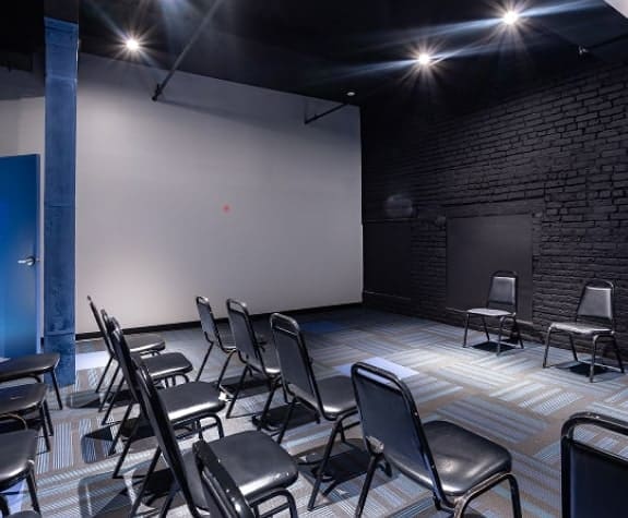Small meeting or corporate event held in a classroom-style space at iO Theater in Chicago