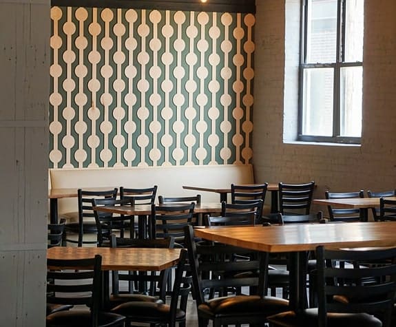 The River Room event space prepared with dining tables to accommodate a wide range of private events